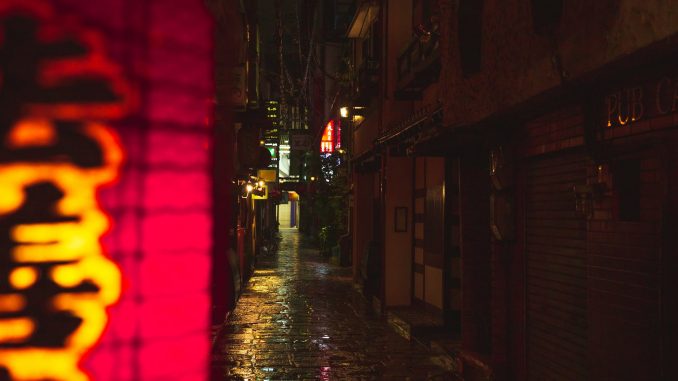 pexels-photo-5473185 narrow street with wet cobblestone footpath