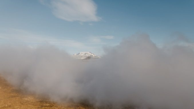 misty mountainous terrain on clear day